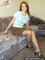 Teen brunette plays with pantyhose