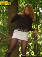 Teen blonde pisses on a log