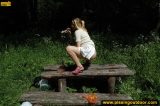 Pissing outdoor on a wooden table