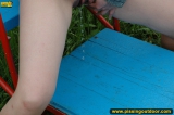 Pissing on a outdoor teeterboard