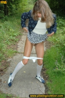 MILF pissing outdoor on park path
