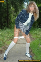 MILF pissing outdoor on park path