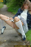 MILF pissing outdoor on park path