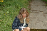 MILF pissing outdoor on park path