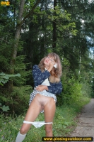 MILF pissing outdoor on park path