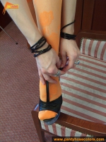 Orange pantyhose fetish teen girl posing on the floor