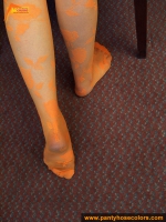 Orange pantyhose fetish teen girl posing on the floor