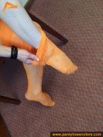 Orange pantyhose fetish teen girl posing on the floor