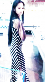 Sexy filipino babe in long striped skirt shopping for meat