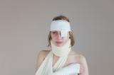 Bandaged injured sex slave