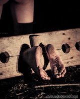 Nude teen in medieval torture