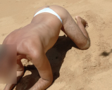 shemale ladydilva in a bikini on the beach showing off her a