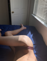 Young teen boy showing off in his thong