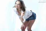 Playful girl proudly shows body