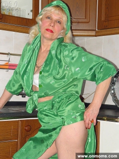 Mature housewife undressing in the kitchen - N