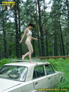 Brunette pissing in a forest - N