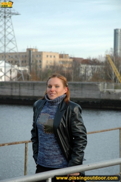 Pissing on the bridge over river - N