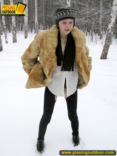 Pissing outdoor in the snow in winter day - N