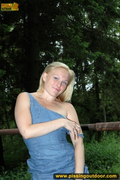 Teen blonde pisses outdoor on the road blocking stone - N