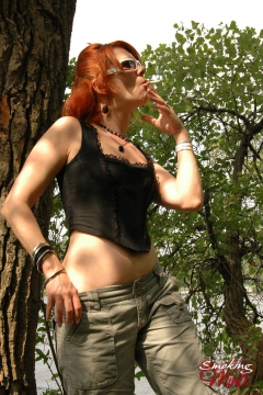 Sexy redhead smoking vixen Mina kinky in the outdoors - N