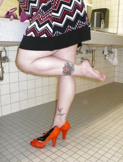 April washes her feet in the ladys room - N