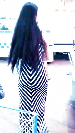 Sexy filipino babe in long striped skirt shopping for meat - N