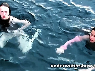 Three girls swimming nude in the sea