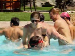 Group of swingers have fun in the pool playing nasty games