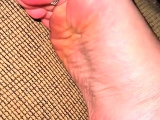 Cute teen girl enjoys foot fetish