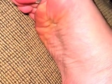 Cute teen girl enjoys foot fetish