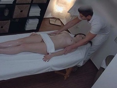 Young brunette enjoys erotic massage